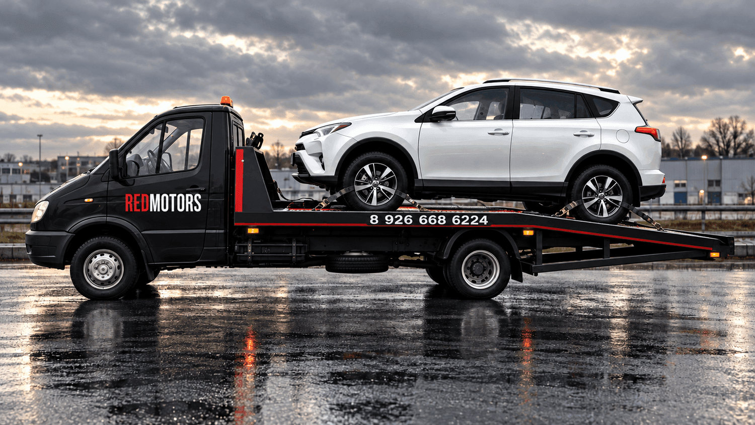 Чёрный эвакуатор RED MOTORS с белым RAV4